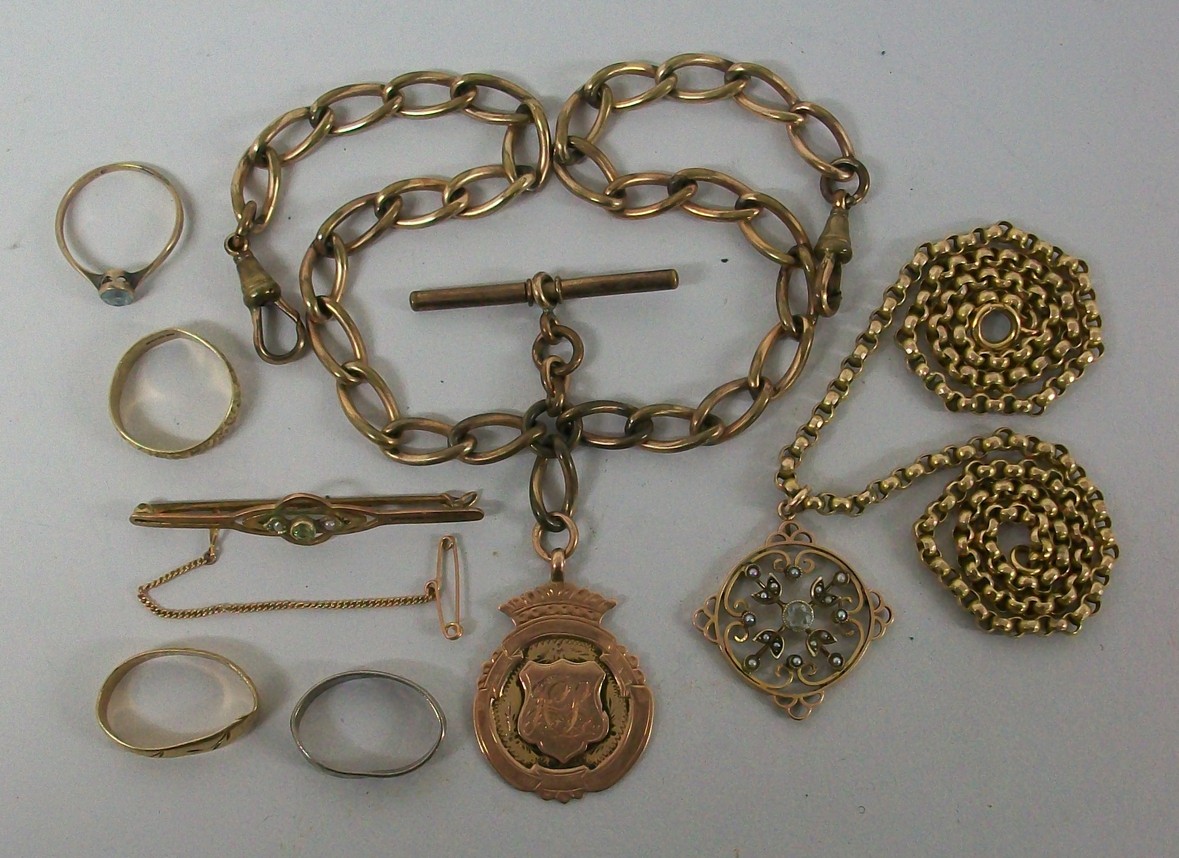 A 9ct gold medallion, two 9ct gold rings, a 9ct gold chain and pendant, a 9ct gold ring with