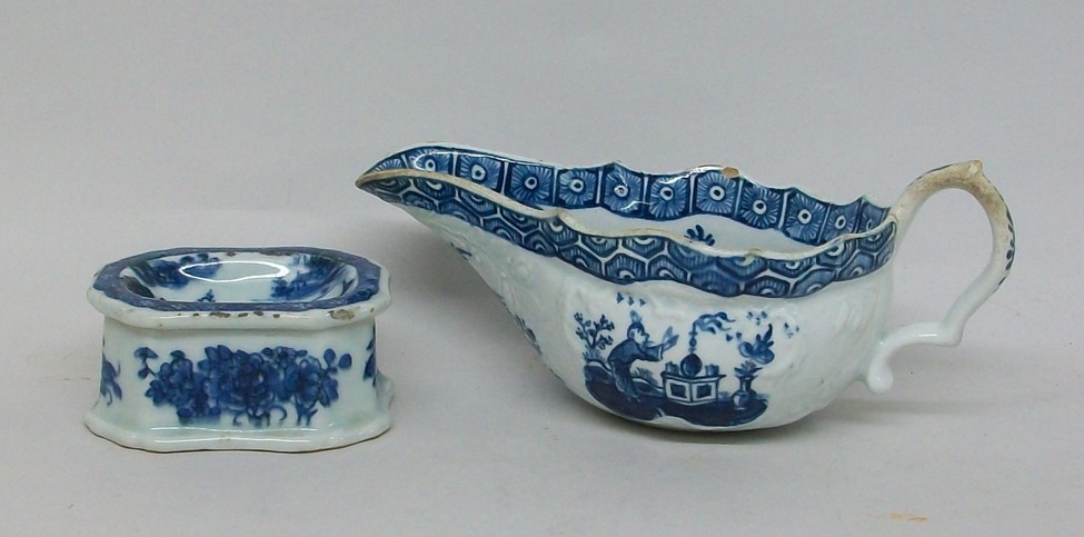 A Qing dynasty, late 18th century, blue and white trencher salt decorated with a pagoda landscape