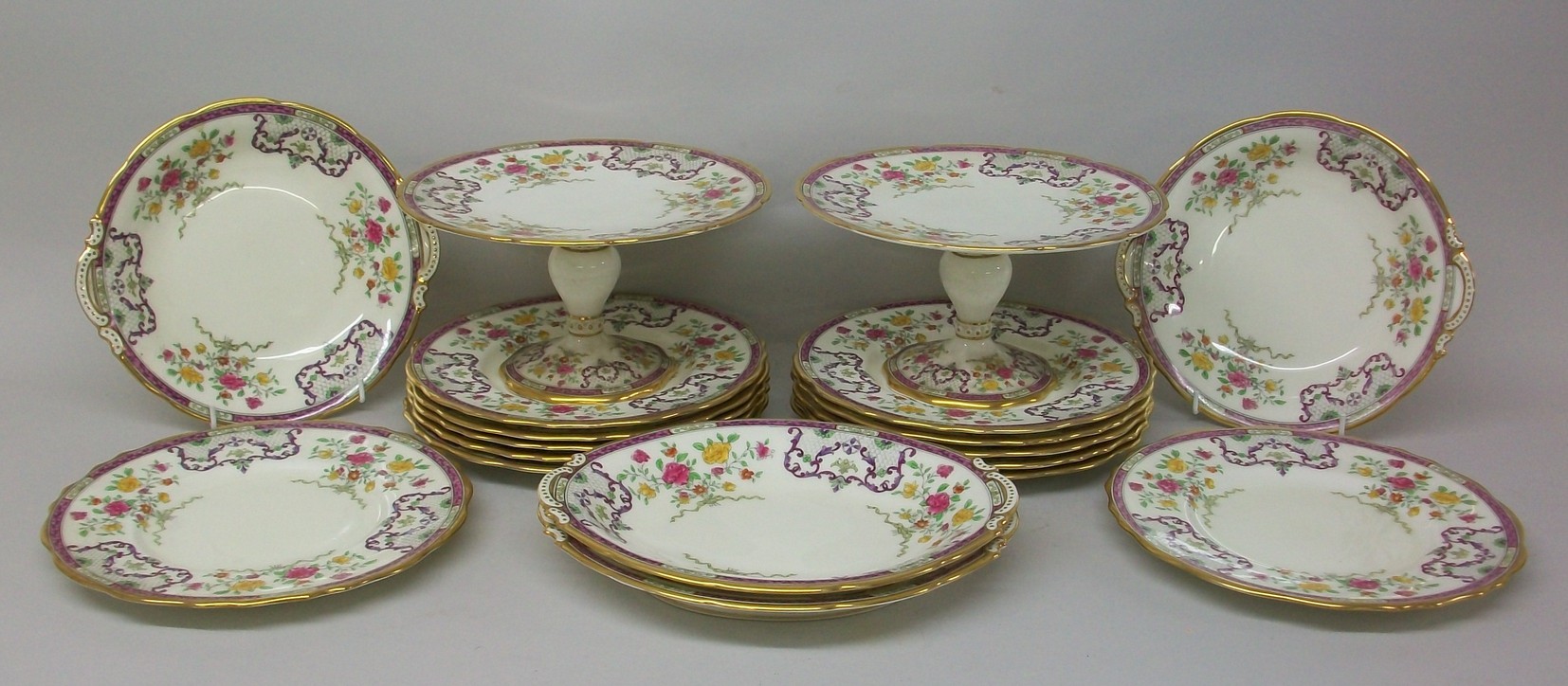 A Cauldon porcelain part dessert service, early 20th century, decorated with bouquets of flowers and
