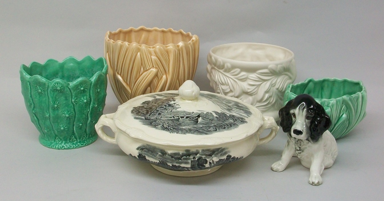 A group of Sylvac pottery, comprising; a black and white dog, 18, a green vase, 2248, a green leaf
