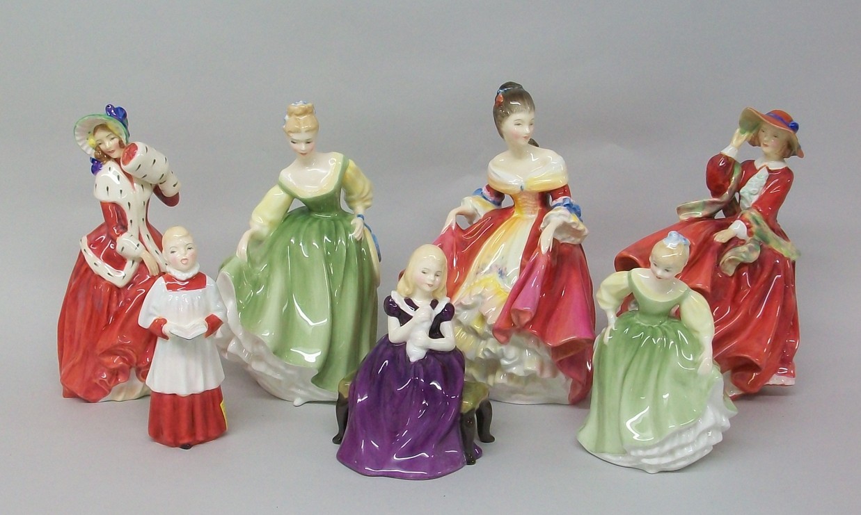 A group of seven Royal Doulton figures, comprising; Southern Belle, HN2229, Fair Lady, HN2193, Top