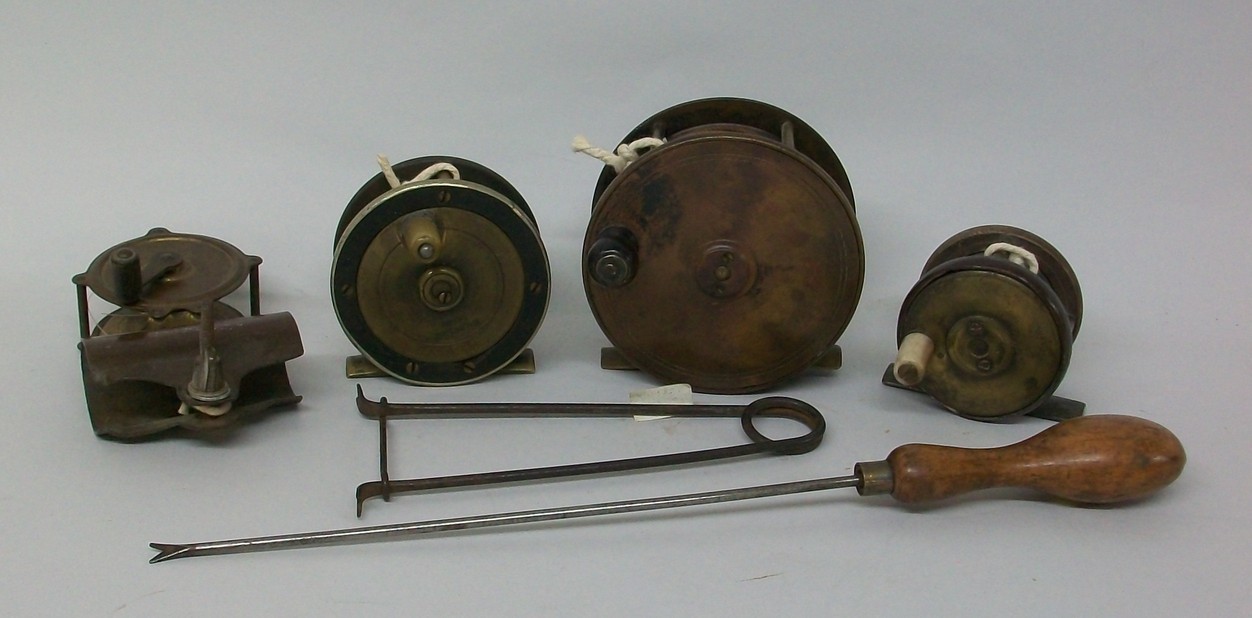 A brass and bakelite fishing reel, early 20th century, by Walbran Ltd, Leeds, brass and bakelite