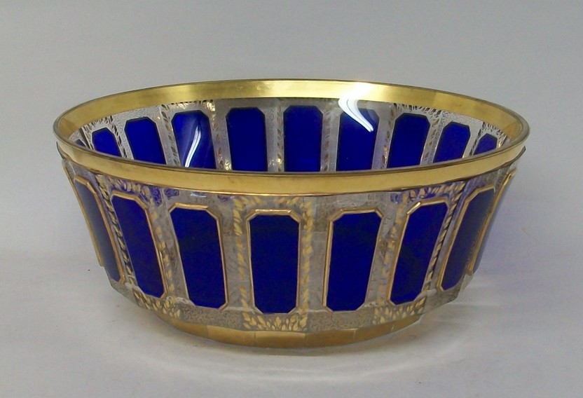 A Bohemian blue faceted glass bowl with gilt leaf and vermicelli decoration, 23 by 9cm.