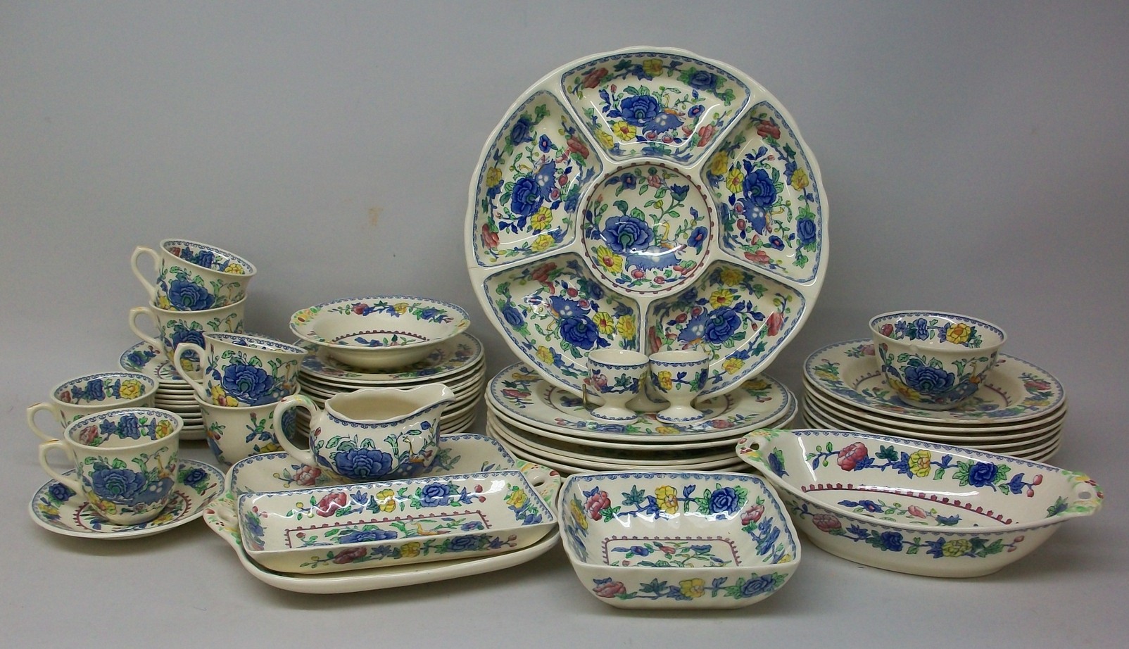 A Masons ironstone part dinner service decorated in the `Regency` pattern, comprising; six dinner