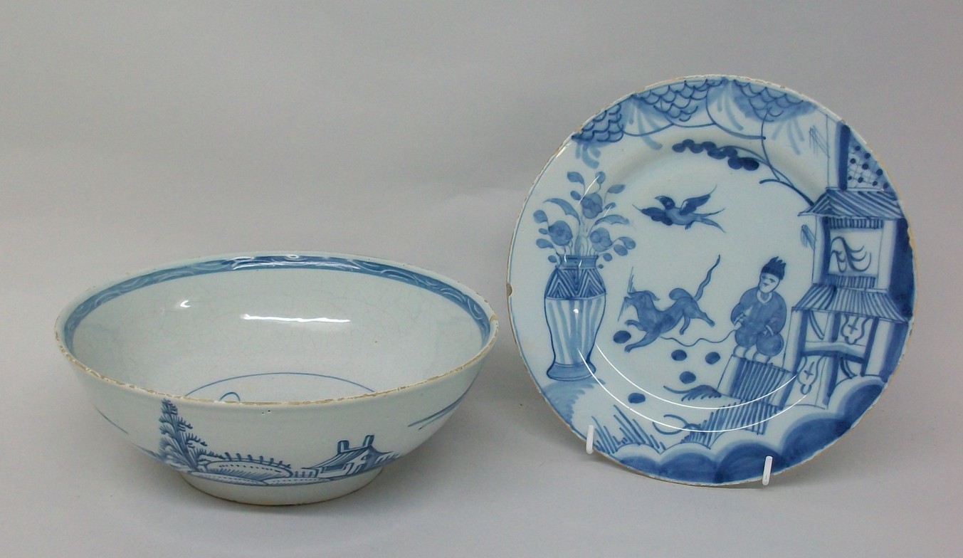 A tin-glaze earthenware plate, mid 18th century, decorated in blue and white with chinoiserie