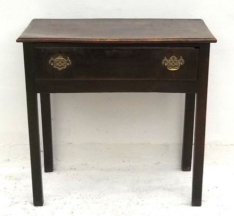 A George I elm side table with a single frieze drawer, 76 by 42 by 72cm high.