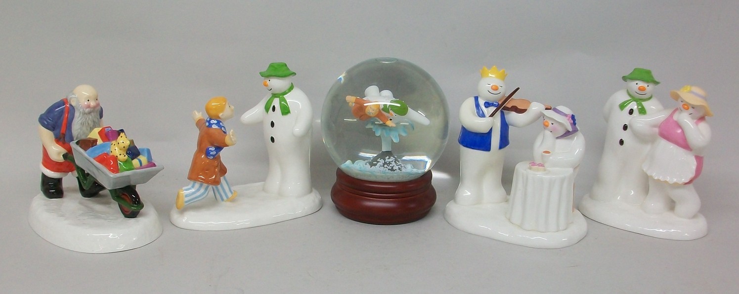 A group of four Coalport The Snowman figures, comprising; `At The Party`, `I`ll Never Forget