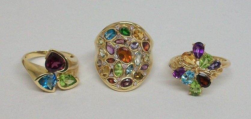 A 9ct gold and multi gem set cluster ring, size R, 9ct gold multi gem set curvilinear ring, size