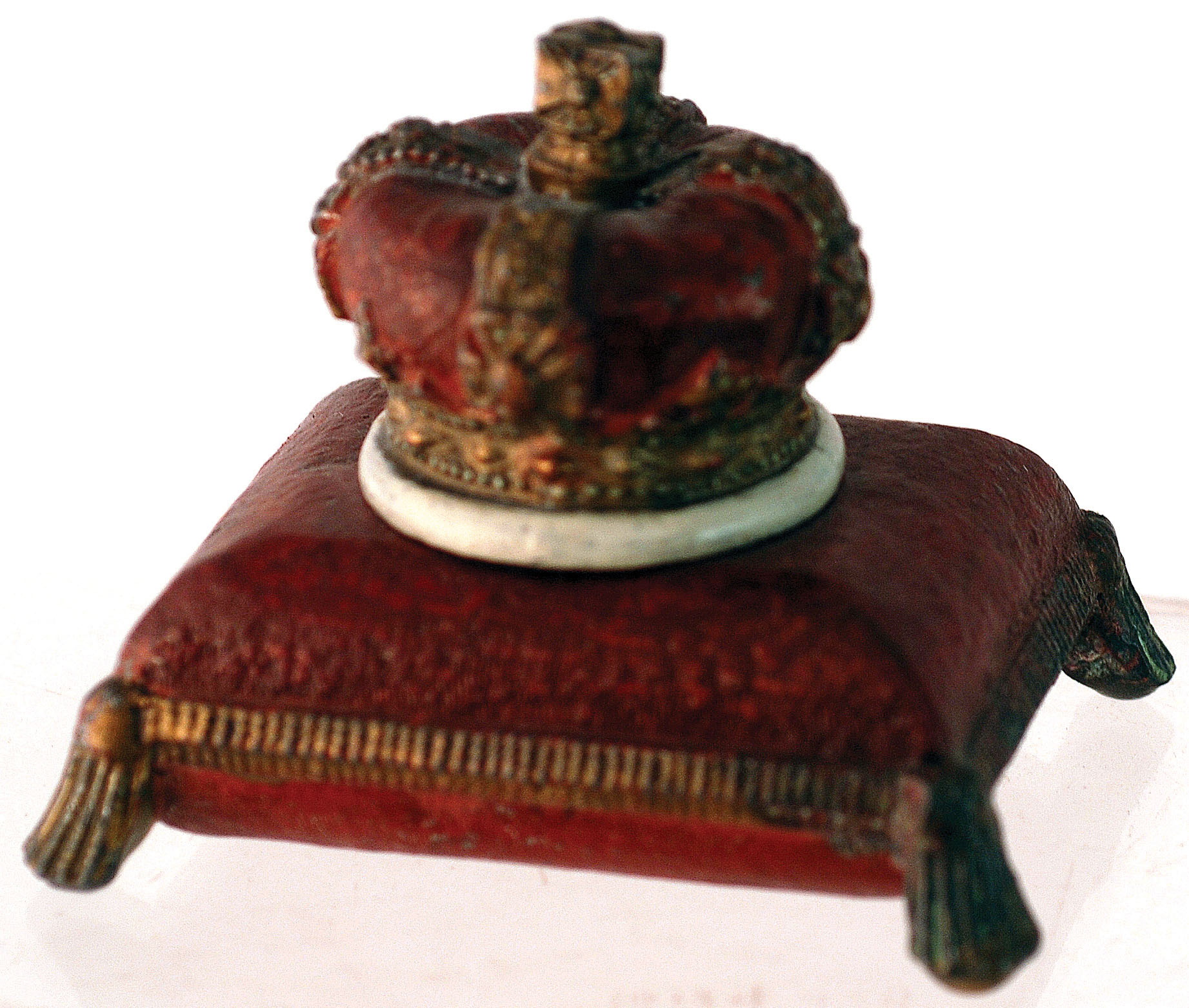 CROWN ON CUSHION INKWELL. 2.75ins tall, metal inkwell formed as a crown on cushion. Red & gold