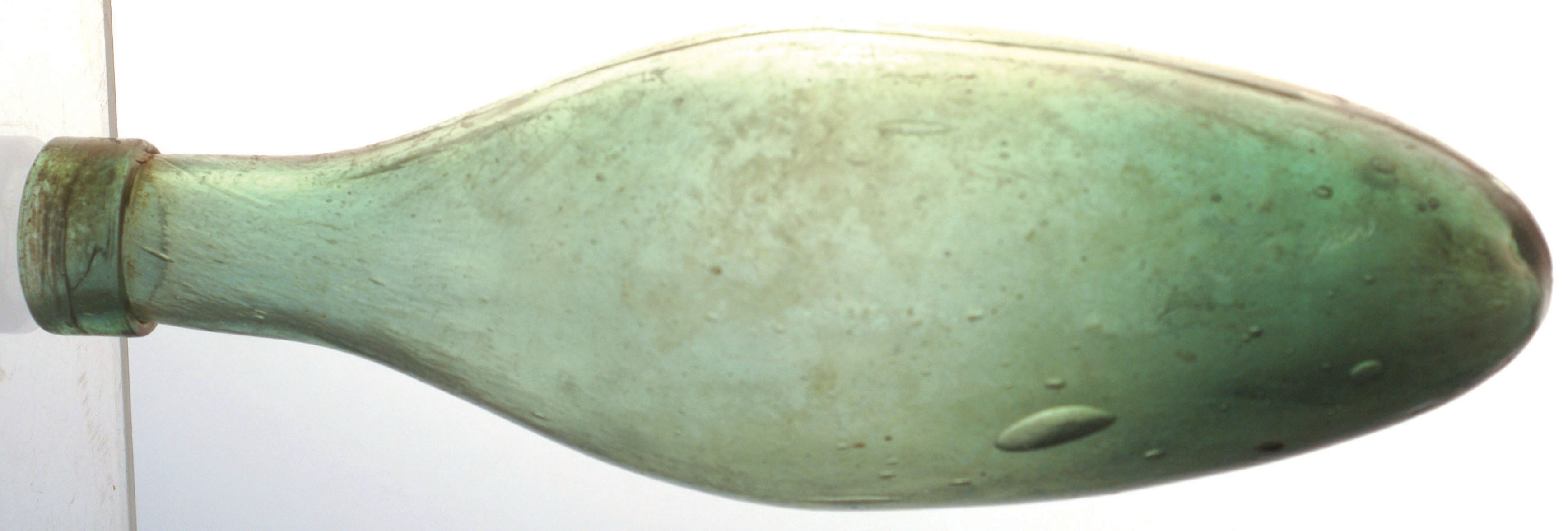 HAMILTON BOTTLE. 8.75ins long, dark aqua glass with square (early) lip unembossed. (NR)