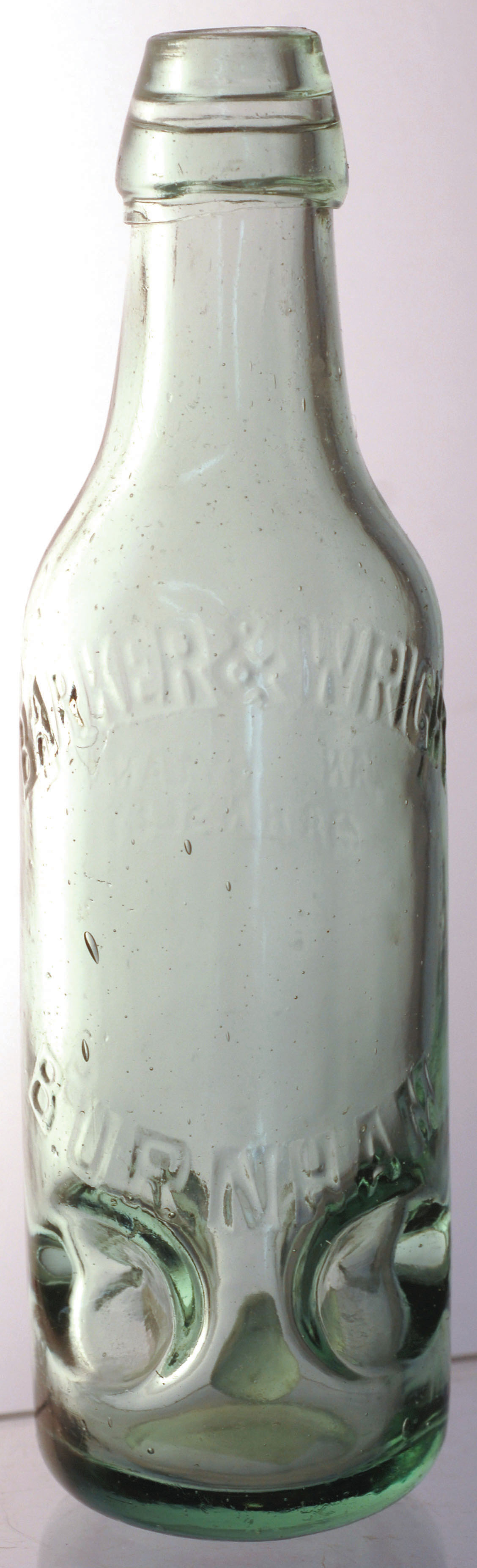 RYLANDS PREMIER PATENT BOTTLE. 9ins tall, aqua glass with 4 circular indents near base embossed ‘