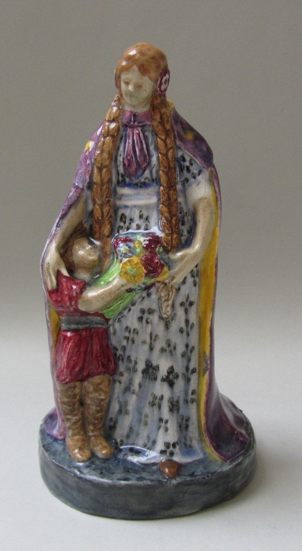 A pottery figure group, early 20th century, in the manner of Charles Vyse (1892-1963), modelled as