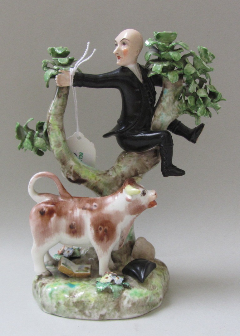 A Derby (Stevenson & Hancock) porcelain figure group, late 19th century, modelled with Dr. Syntax