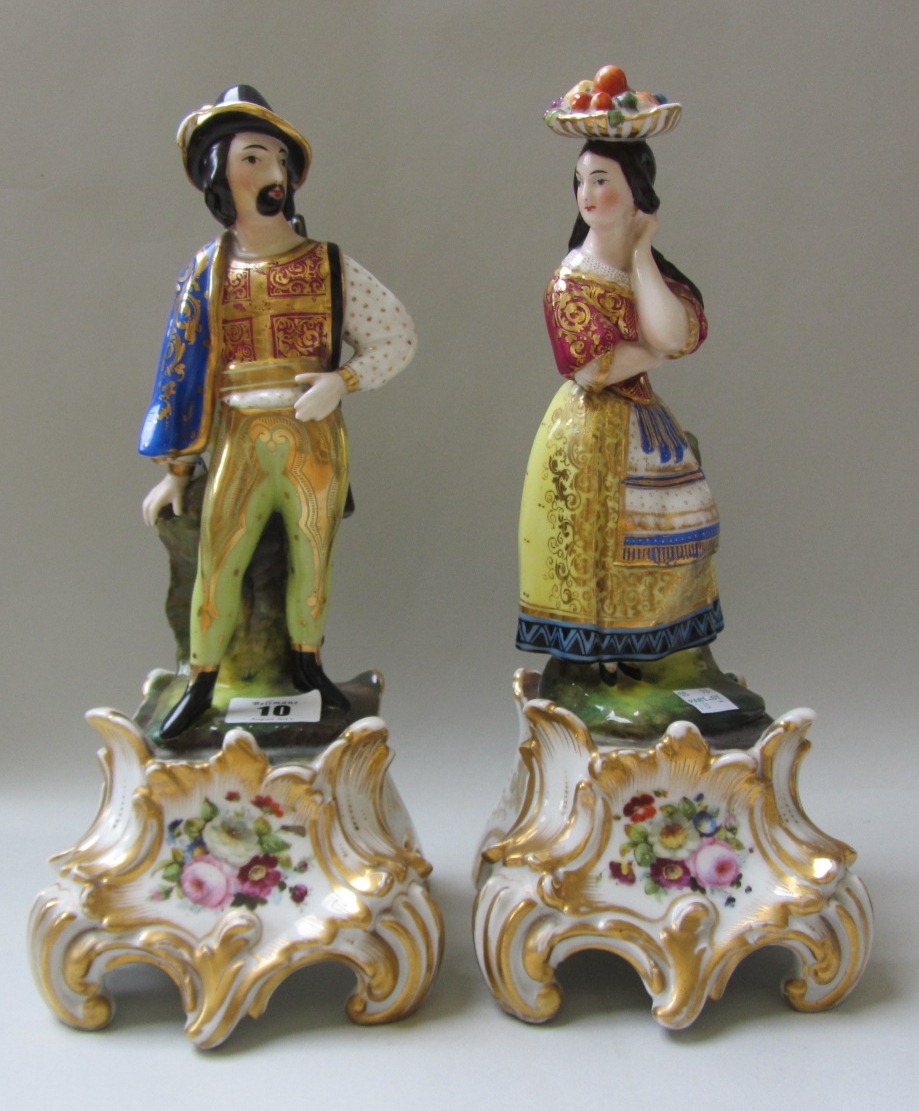 A pair of Jacob Petit style porcelain figures modelled as a gallant and his companion, early 20th
