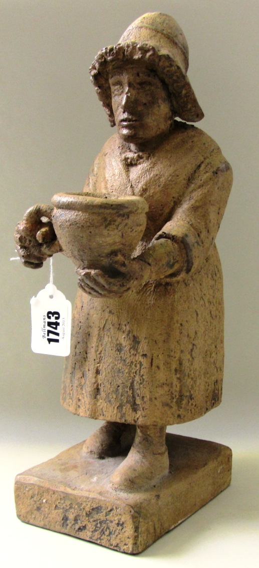 Folk Art; a painted and carved oak figure, late 18th century, modelled as a Welsh lady carrying a