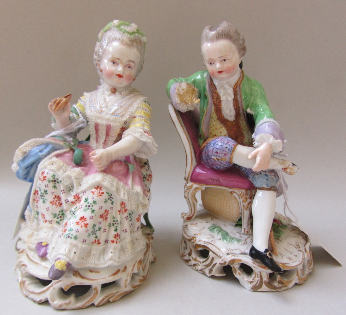 A pair of Meissen figures, late 19th century, modelled as a gallant and companion at leisure, each