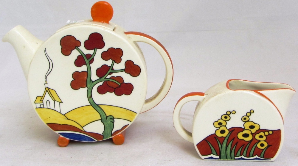 A quantity of Clarice Cliff pottery including; two graduated oval platters, a 'crocus' preserve