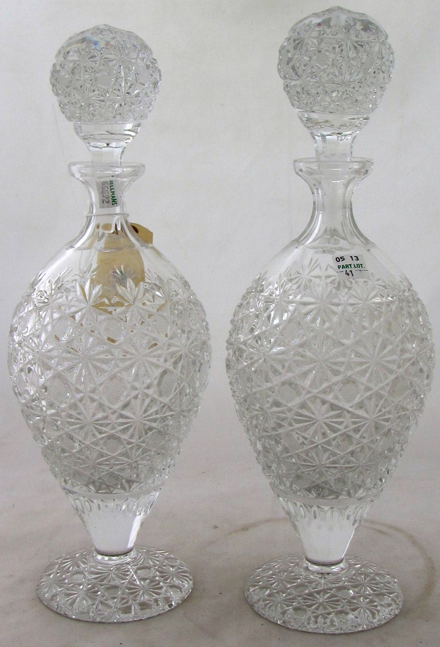 A pair of cut and moulded glass decanters and stoppers, 35cm high, (2).