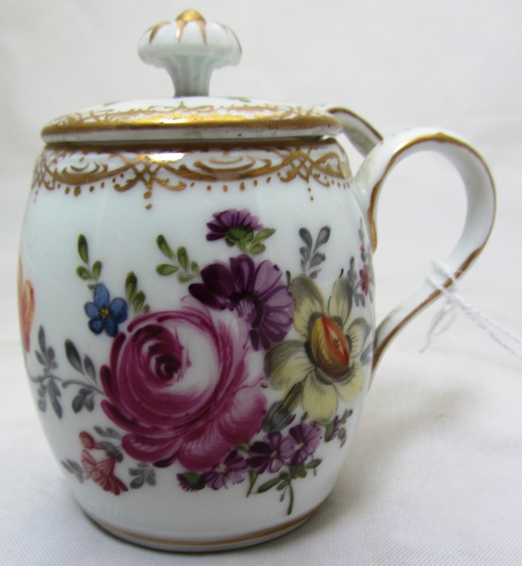A group of Dresden porcelain painted with flowers, early 20th century, comprising a mustard pot,