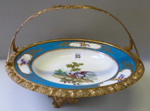 A Sevres porcelain soup bowl, 18th century, 22cm diameter, later painted with exotic birds within
