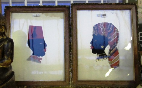 A pair of felt embroidered portrait busts, early 20th century, depicting a male and female