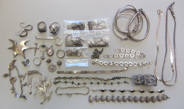 A collection of mostly silver jewellery, comprising; three brooches, two pairs of earrings, a