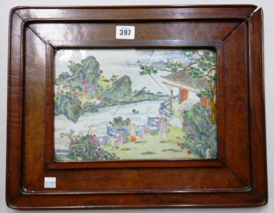 A Chinese famille rose rectangular plaque, late 19th century, painted with figures in a fenced
