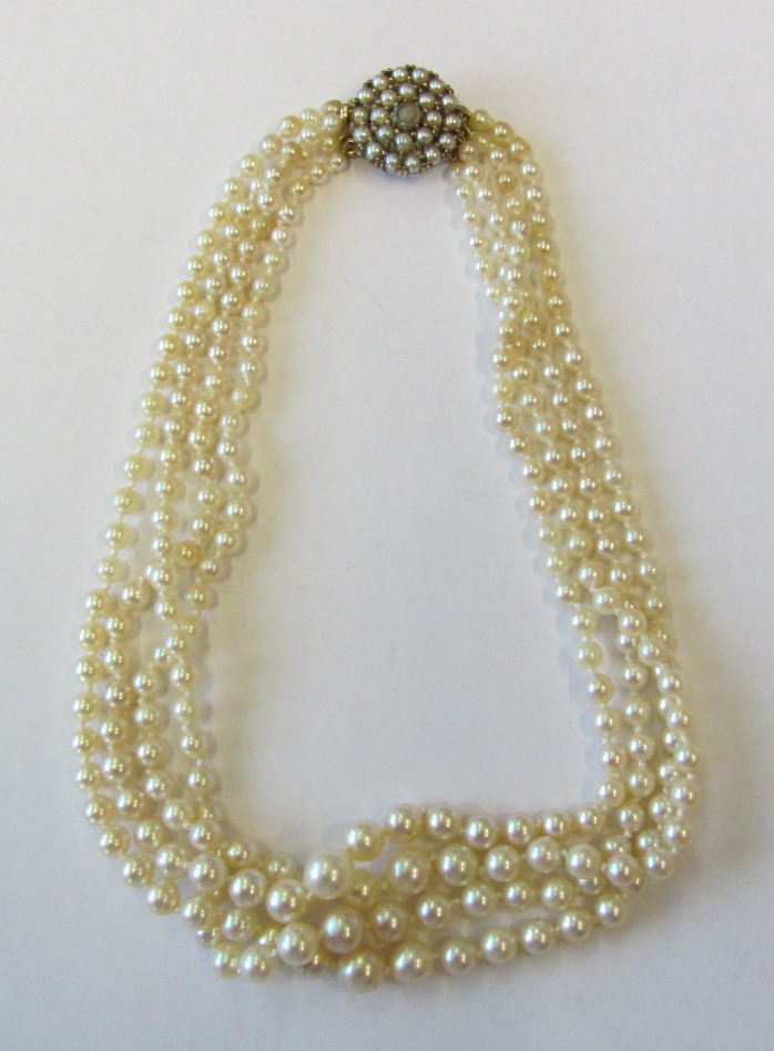 A cultured pearl collar necklace, formed as four rows of graduated cultured pearls, on a 9ct gold