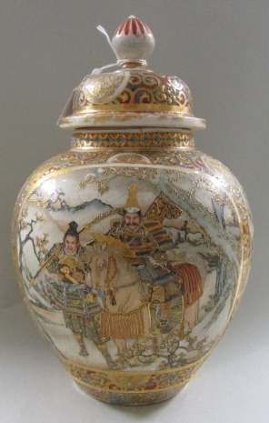 A Japanese satsuma vase and cover, Meiji period, the bulbous body painted with panels of samurai,