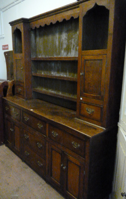 A 19th century and later oak dresser with fitted enclosed plate rack 187cm wide