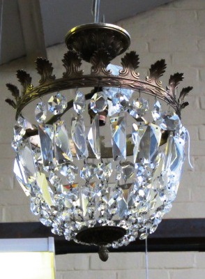 Three matching brass and cut glass bag chandeliers, 20th century, each moulded circlet hung with