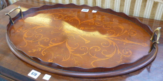 A late 19th century mahogany marquetry inlaid oval serving tray, 57cm wide.