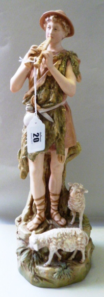 Large Royal Dux figure of a shepherd playing pipes accompanied by two sheep, c.1890, Model No.