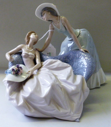 A Lladro porcelain figure group, No 5. 486, `Como te va la fiesta`, boxed, 20.5cm high.