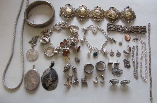 Mostly silver jewellery, comprising, two charm bracelets, an oval hinged bangle, five bracelets, a