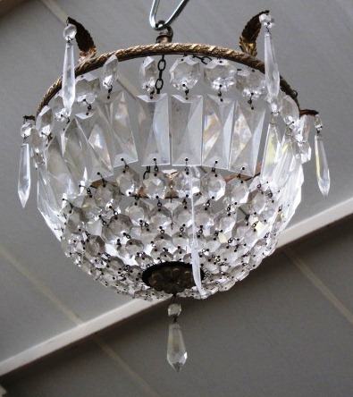 A pair of cut glass bag chandeliers, early 20th century, each brass circlet moulded with single
