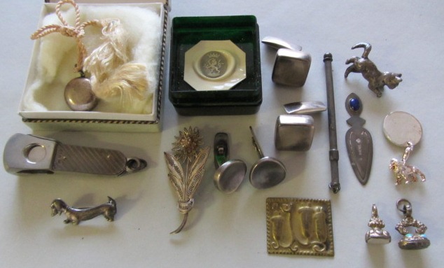 Two Victorian fob seals, a silver swizzle stick, a silver mounted cigar cutter, two pairs of