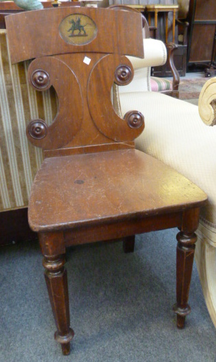 Two 19th century mahogany hall chairs, one on hexagonal supports, the other reeded. ]