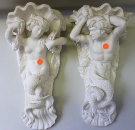 A pair of Minton parian wall plaques/ brackets, early 19th century, each modelled as a mermaid and