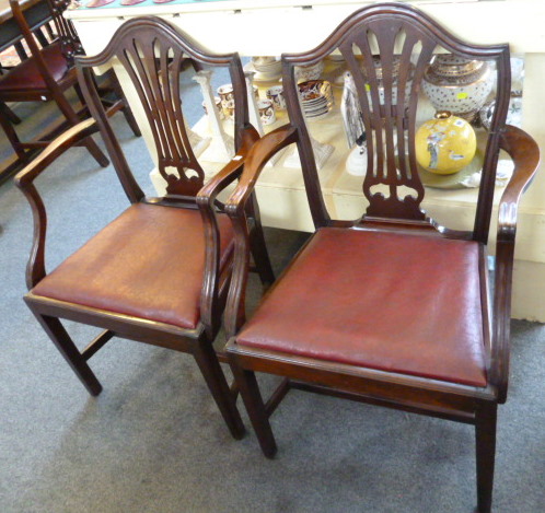 A set of six 19th century mahogany shield back dining chairs with a pair of carvers and a similar