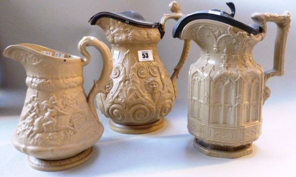 Two Ridgway relief moulded jugs and another larger similar jug, (3).