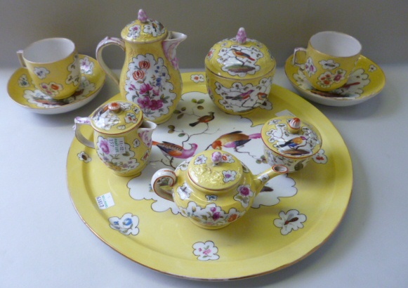 A composite German porcelain yellow ground tete-a-tete, late 19th century, painted with panels of