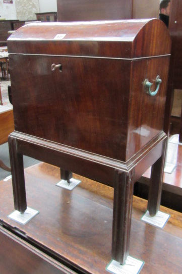 An early 19th century mahogany dome top cellerette, on reeded square supports, 48cm wide. ]