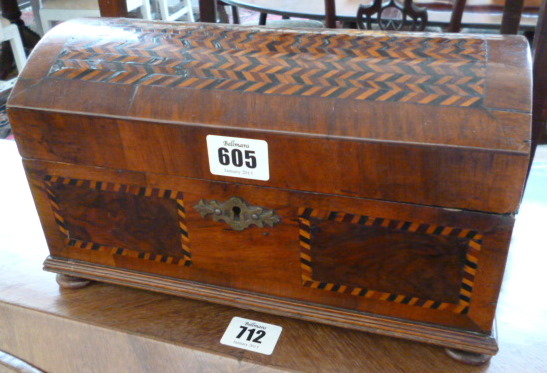 An 18th century walnut domed casket, with parquetry inlay to the hinged lid, 26.5cm wide.