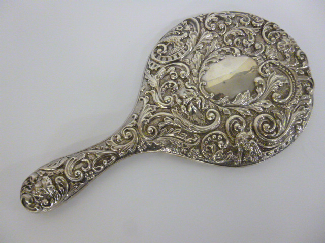 Silver hand mirror embossed with 'Green Man' decoration, original bevel edged mirror and vacant