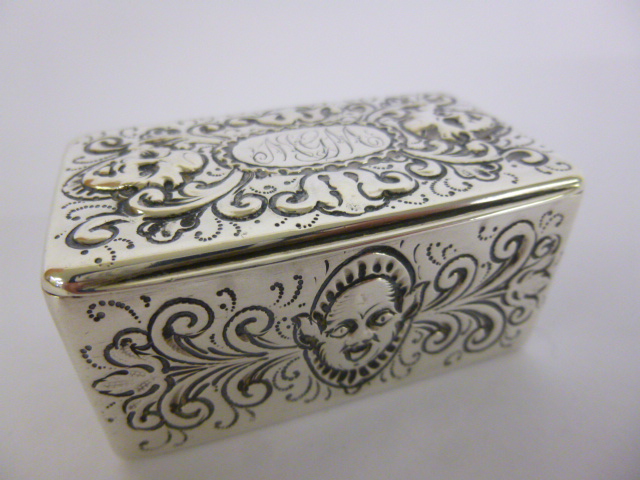Silver snuff box with embossed gargoyle decoration, gilt lined, hallmarked London 1883, maker W.S,