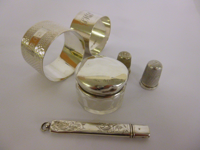 Silver hallmarked needle case, thimble, lidded vanity jar and two napkin rings together with one