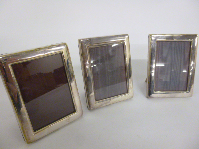 Three Carrs EPNS photograph frames, each measuring 8x10.75cms