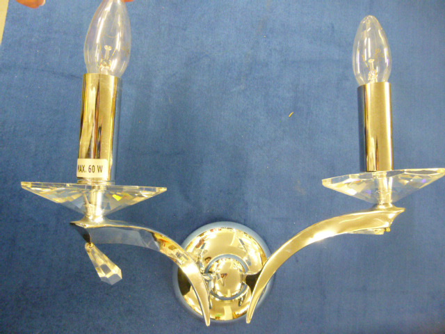 Three contemporary chrome two branch wall lights with crystal scones and drops, approximately