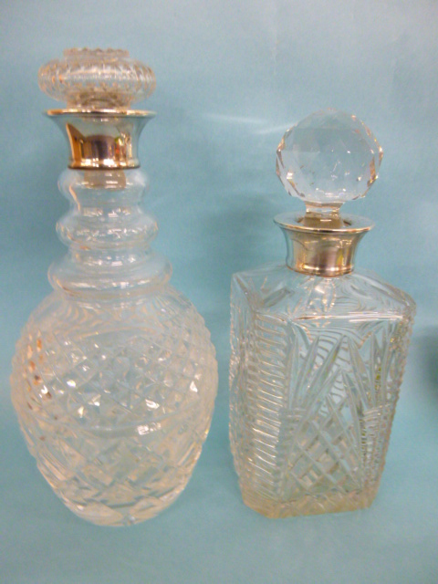 Two silver collared decanters, hallmarked London 1970 & 1971, both by maker A.C.& Ss